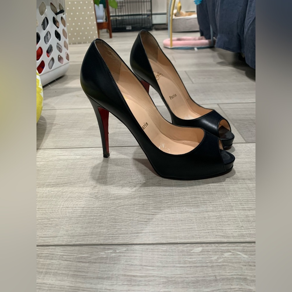 Authentic Louboutin black heels in good condition